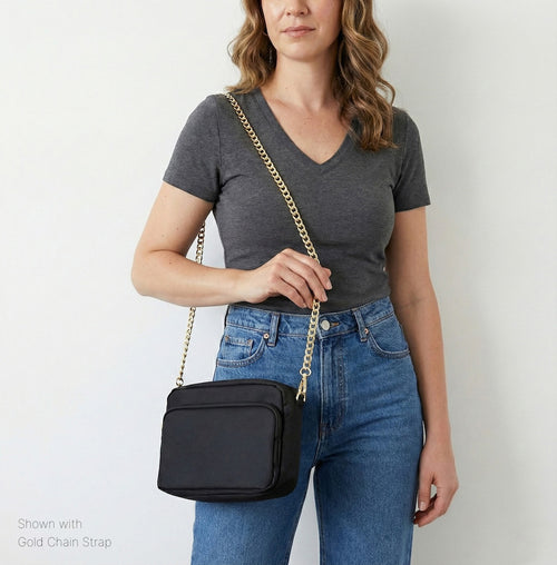 Medium black Canvelle City Crossbody Bag shown with the gold chain strap.