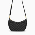 Canvelle Crescent Bag in medium black checkered canvas with gold hardware – front view.