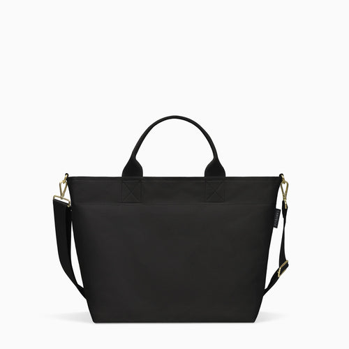 Canvelle Zip Crossbody Tote in medium black recycled polyester canvas with gold hardware - Front view.