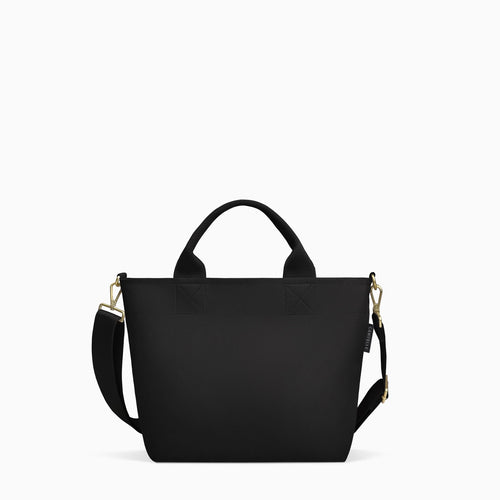 Canvelle Zip Crossbody Tote in small black recycled polyester canvas with gold hardware - Front view.