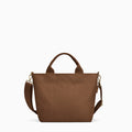 Canvelle Zip Crossbody Tote in small brown recycled polyester canvas with gold hardware - Front view.