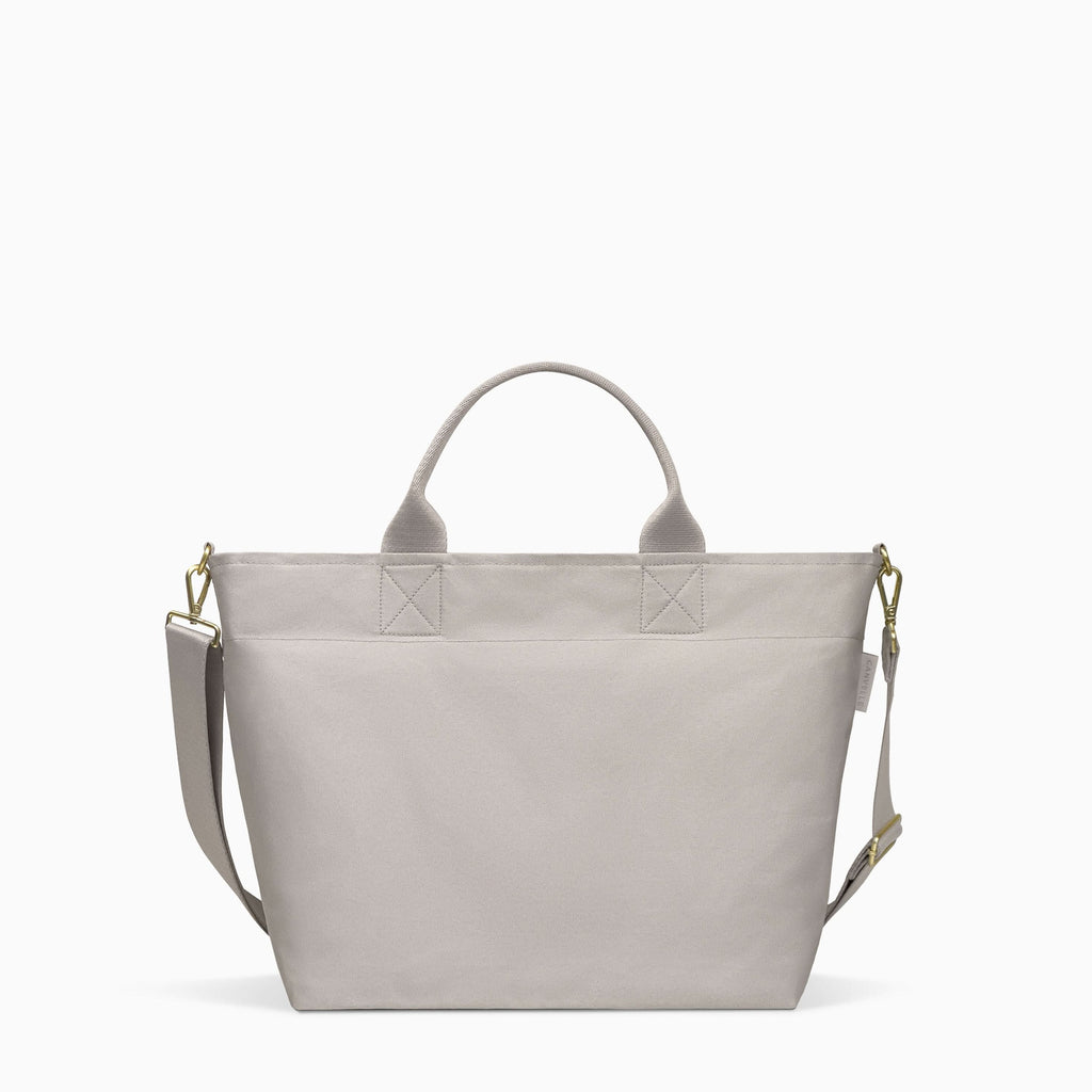 Canvelle Zip Crossbody Tote in medium grey recycled polyester canvas with gold hardware - Front view.