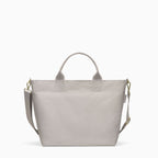 Canvelle Zip Crossbody Tote in medium grey recycled polyester canvas with gold hardware - Front view.