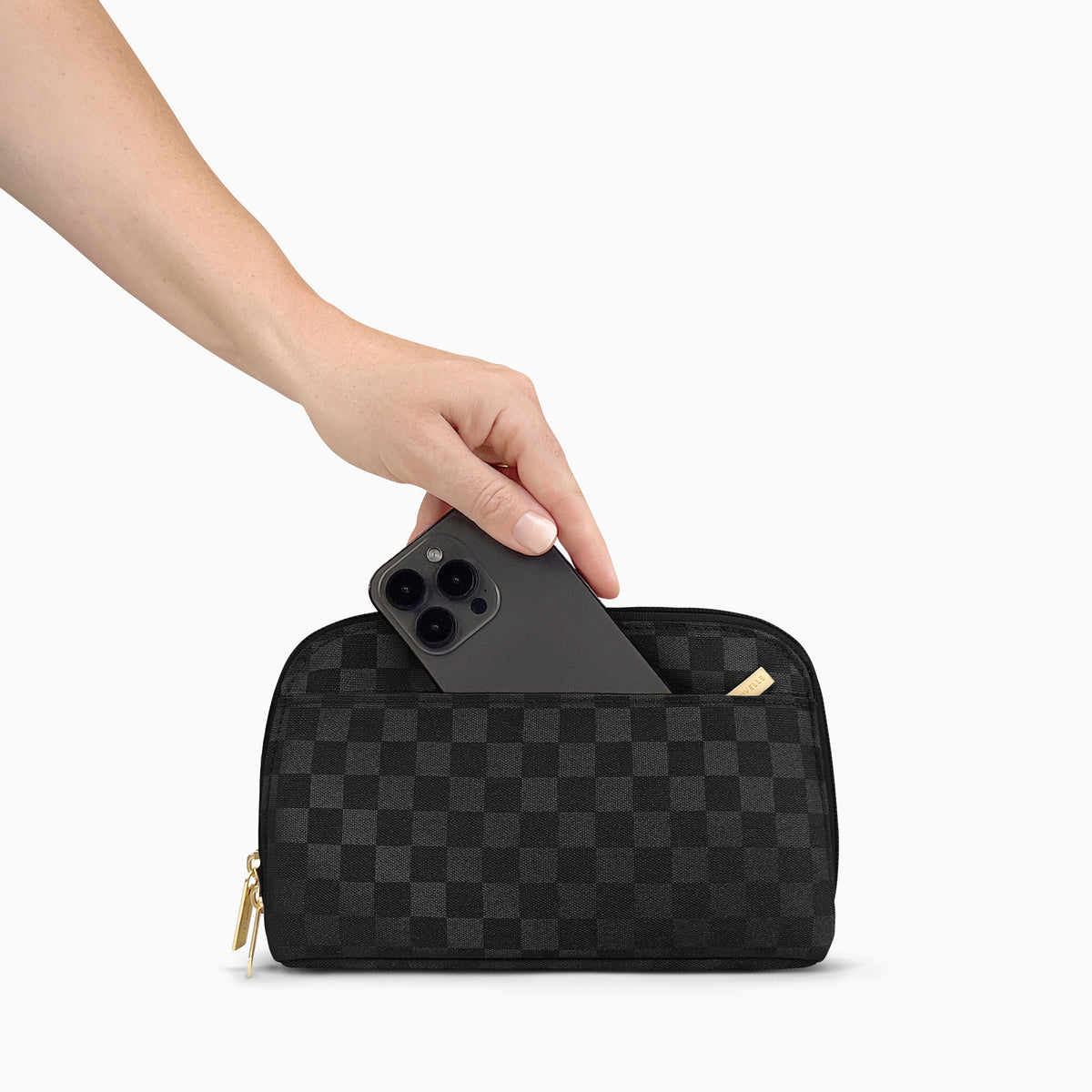 Phone sliding into the front phone pocket of the Black Checkered Canvelle Crossbody Wallet