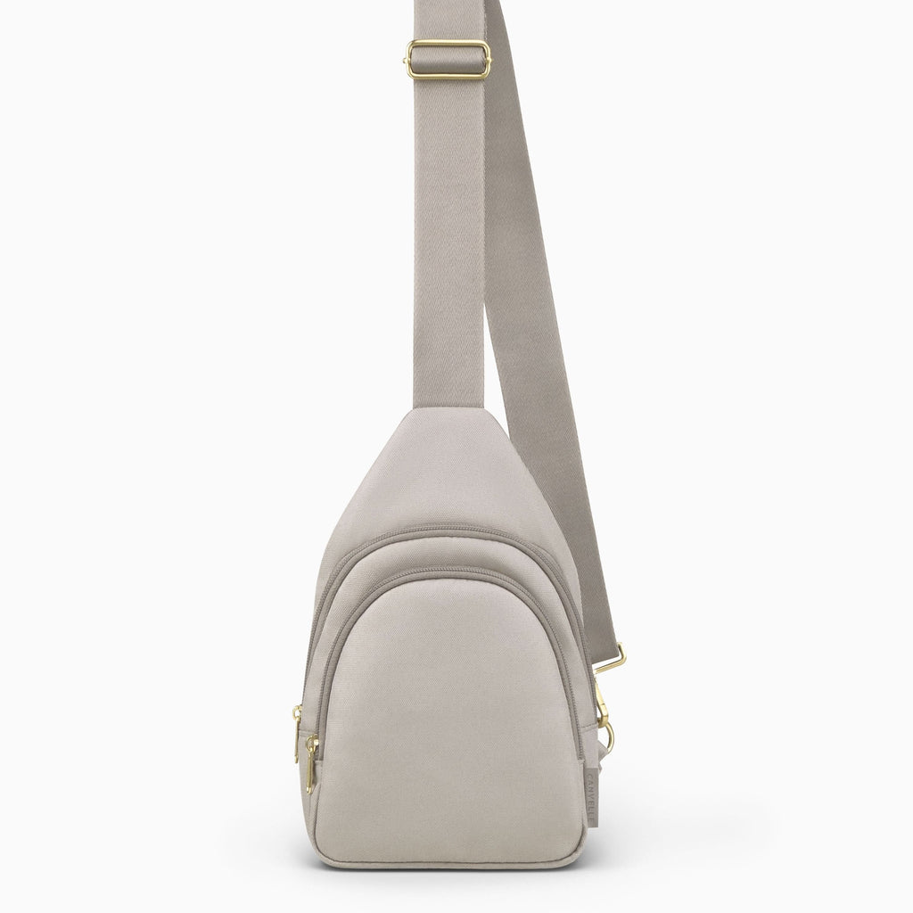 Canvelle City Sling Bag in small grey recycled polyester canvas with gold hardware - Front view.
