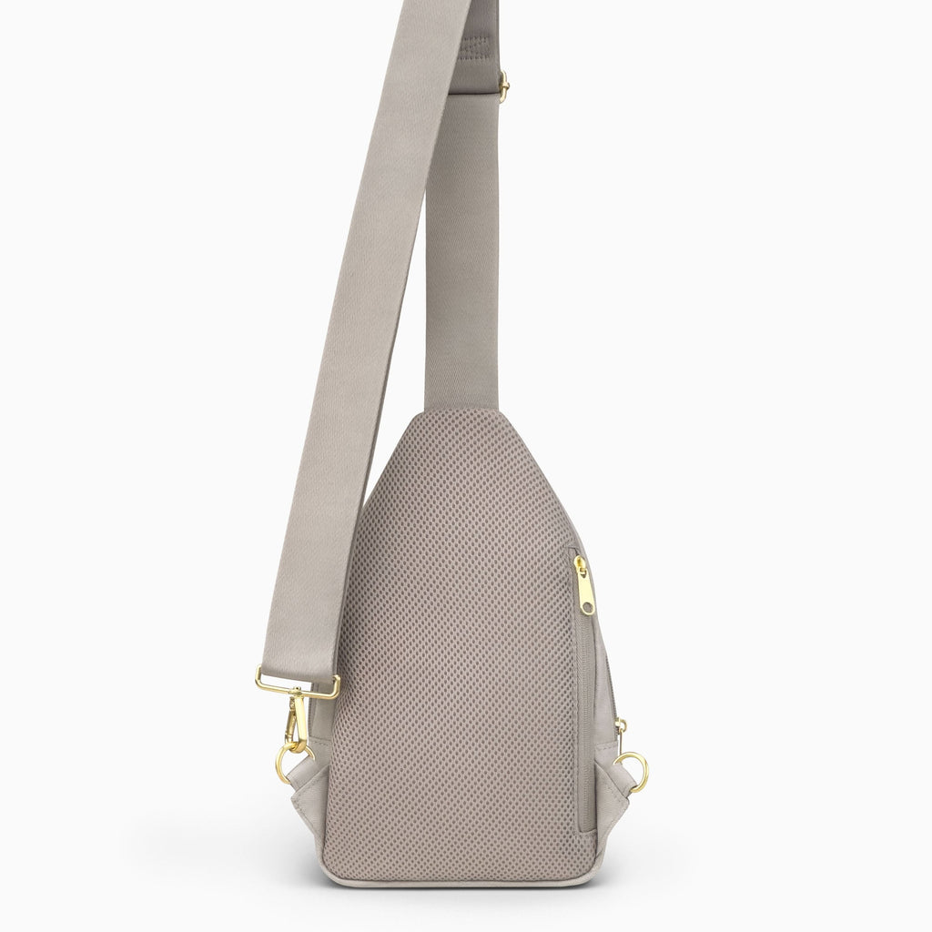 Canvelle City Sling Bag in grey - Back view showing breathable mesh padding, hidden anti-theft zipper pocket, and convertible strap attachments.