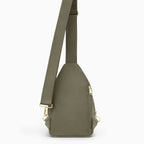 Canvelle City Sling Bag in olive green - Back view showing breathable mesh padding, hidden anti-theft zipper pocket, and convertible strap attachments.
