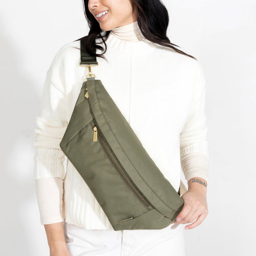 Olive Canvelle Crossbody Fanny Pack worn across the body with a white tee and jeans.