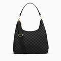 Canvelle Hobo Handbag in large black checkered recycled polyester canvas with gold hardware - Front view with shoulder strap and tucked crossbody strap.