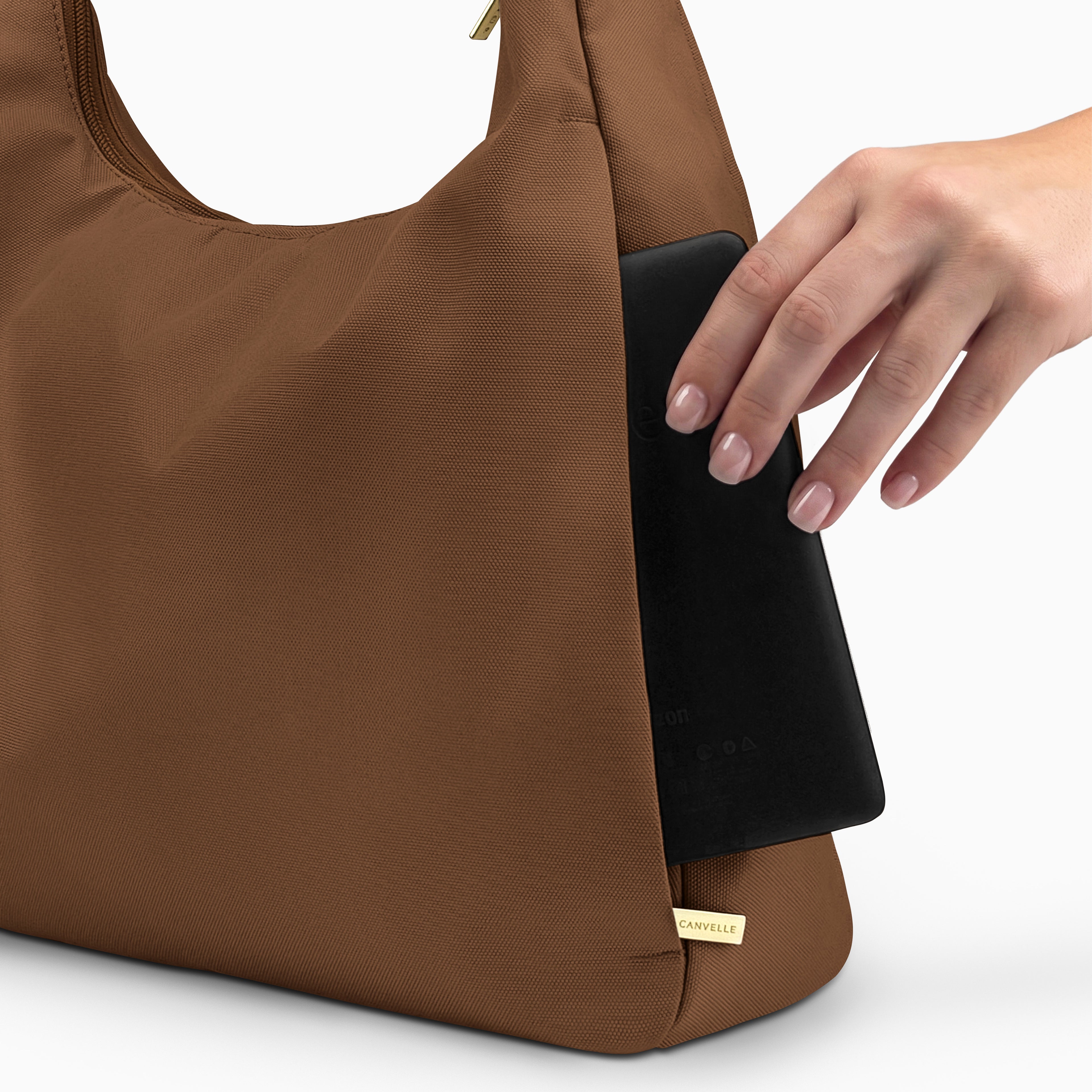 Large brown Canvelle Hobo Handbag back view showing the plain exterior slip pocket, fitting an 8-inch e-reader.