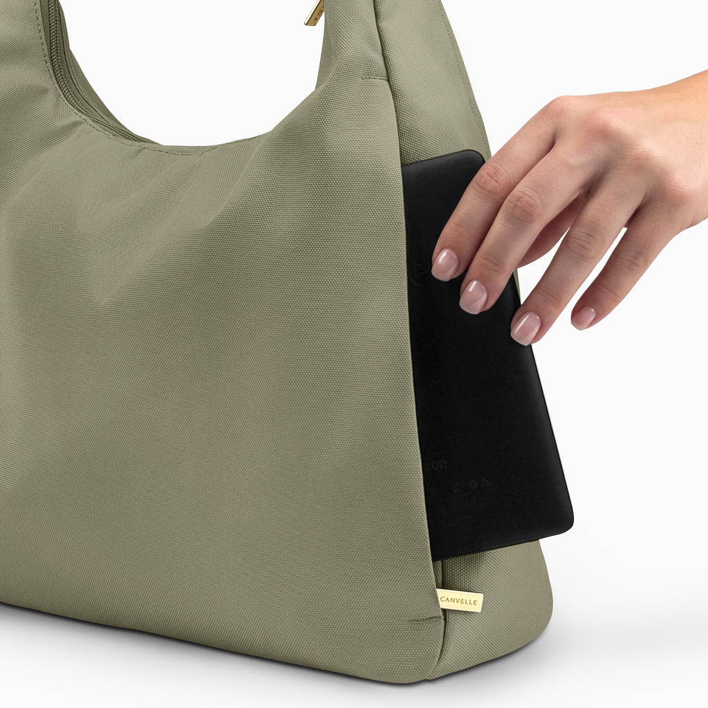 Large olive Canvelle Hobo Handbag back view showing the plain exterior slip pocket, fitting an 8-inch e-reader.