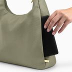 Large olive Canvelle Hobo Handbag back view showing the plain exterior slip pocket, fitting an 8-inch e-reader.