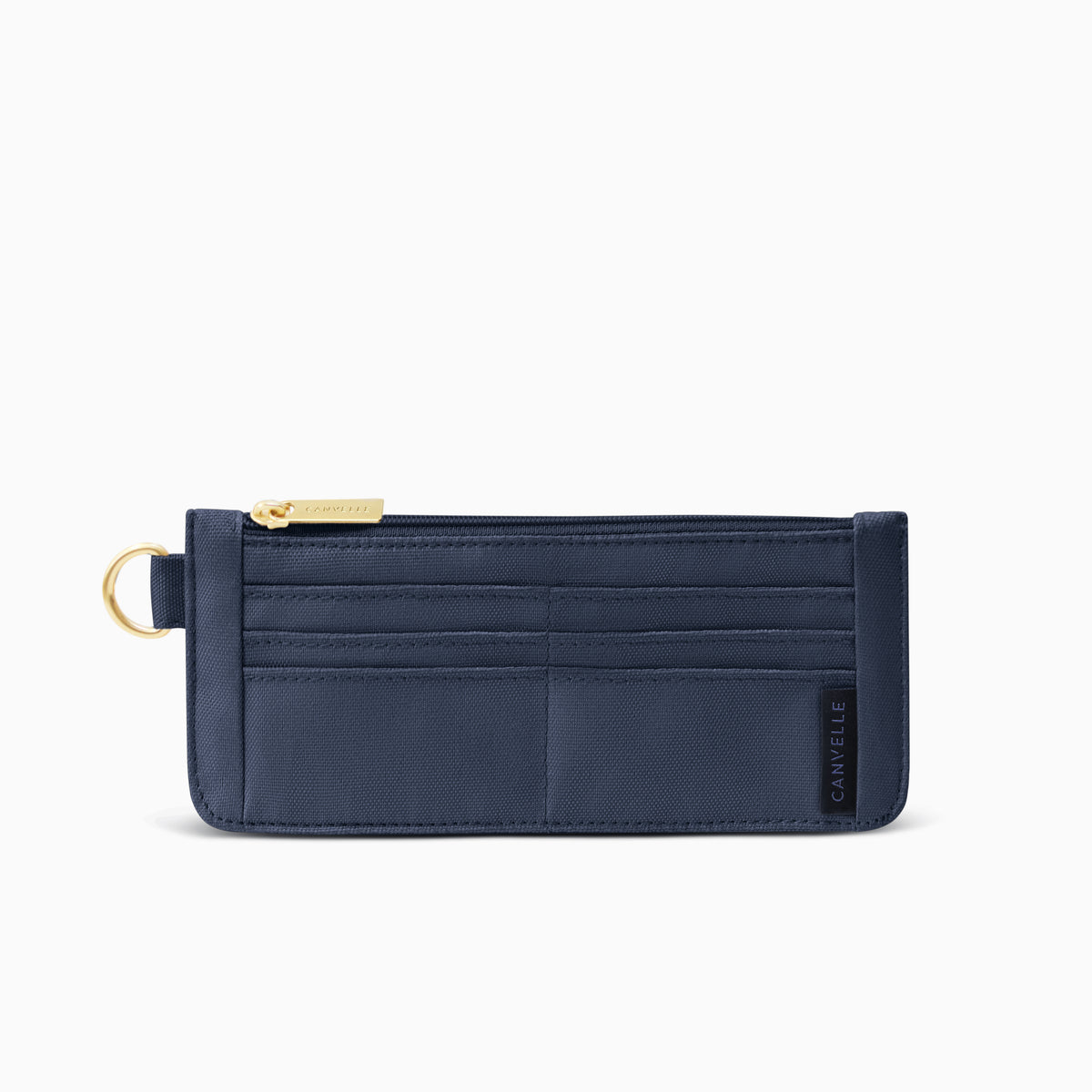 Canvelle Slim Wallet in navy canvas with gold hardware - Front view showing card slots.