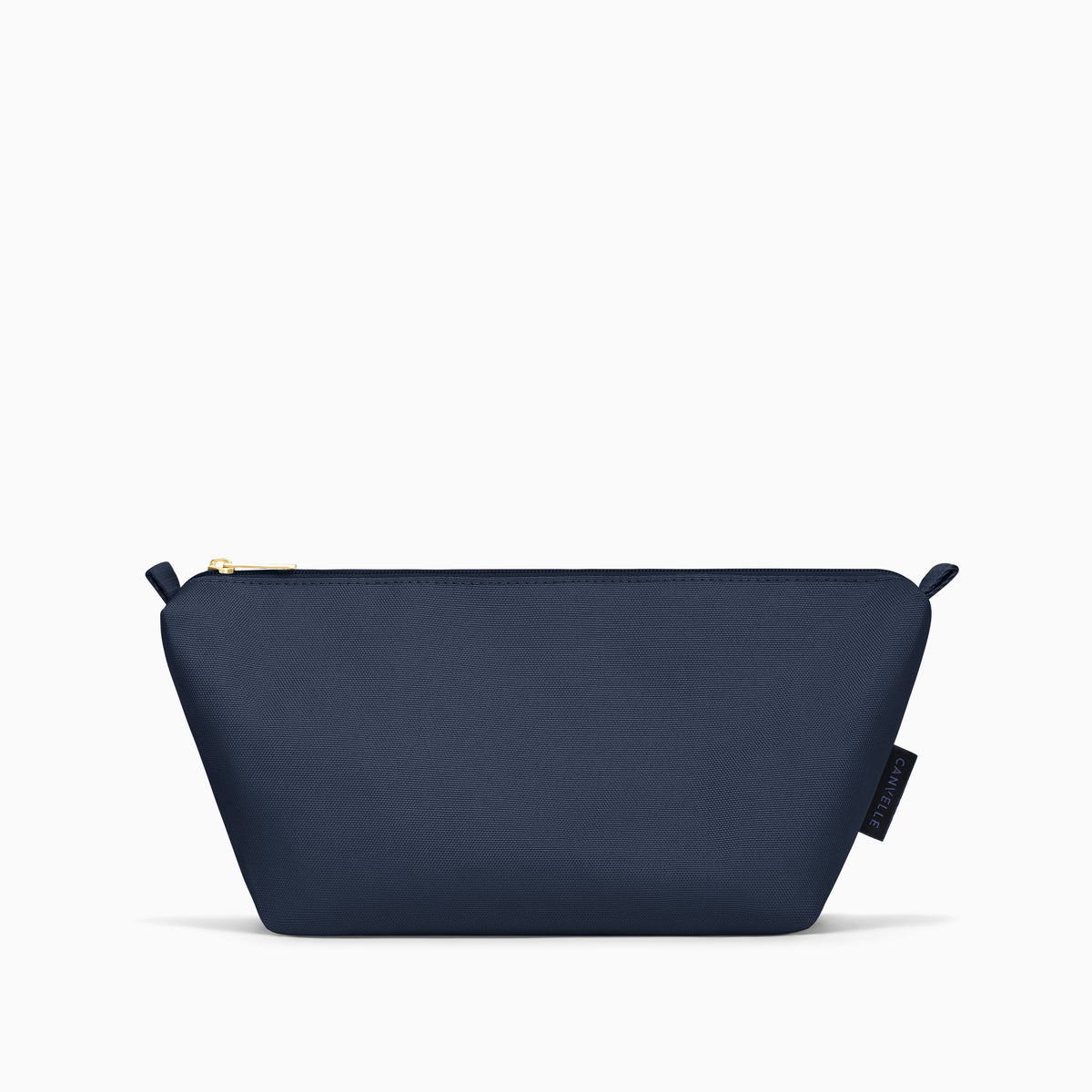 Front view of the medium navy Canvelle Toiletry Pouch with gold zipper pull.