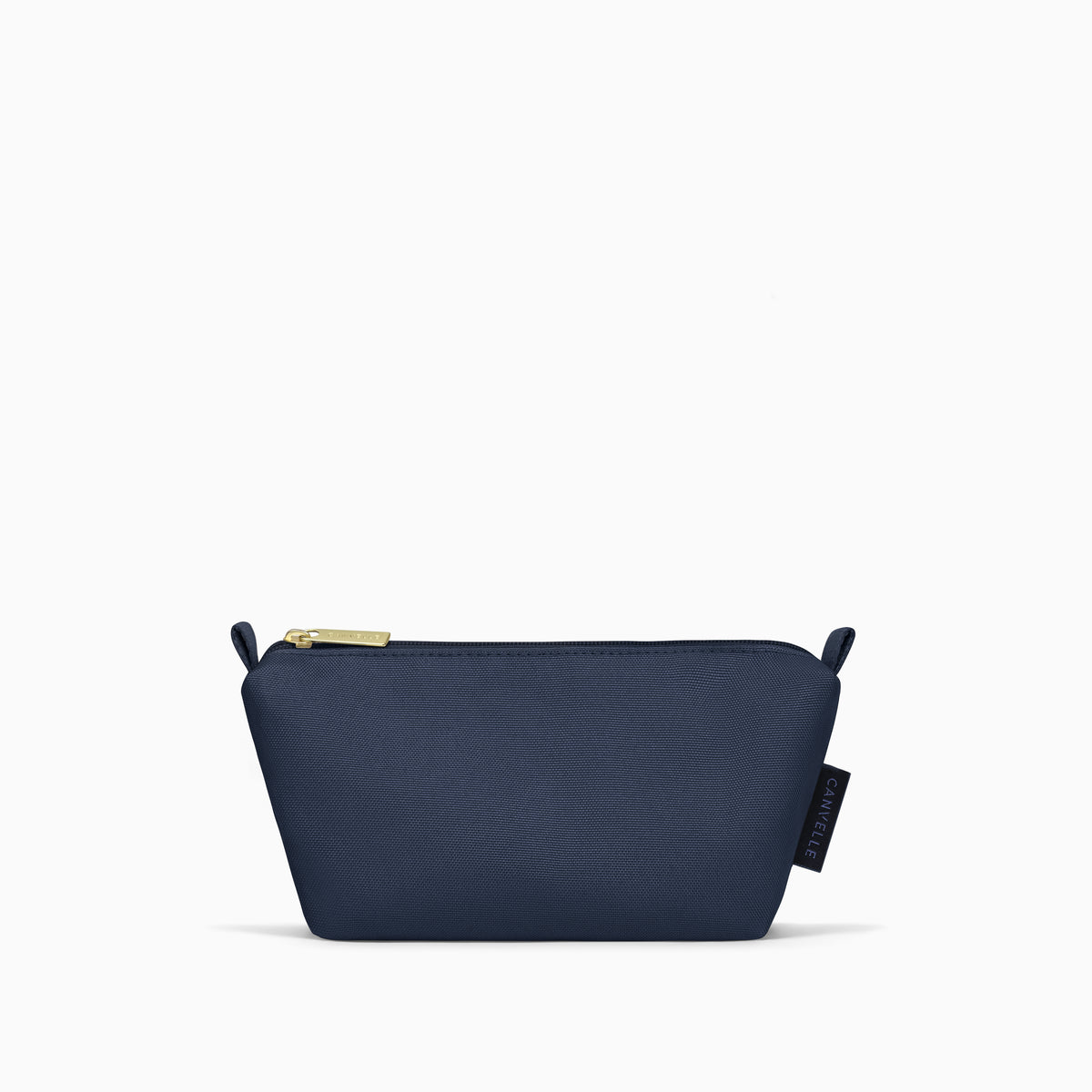 Front view of the small navy Canvelle Toiletry Pouch with gold zipper pull.