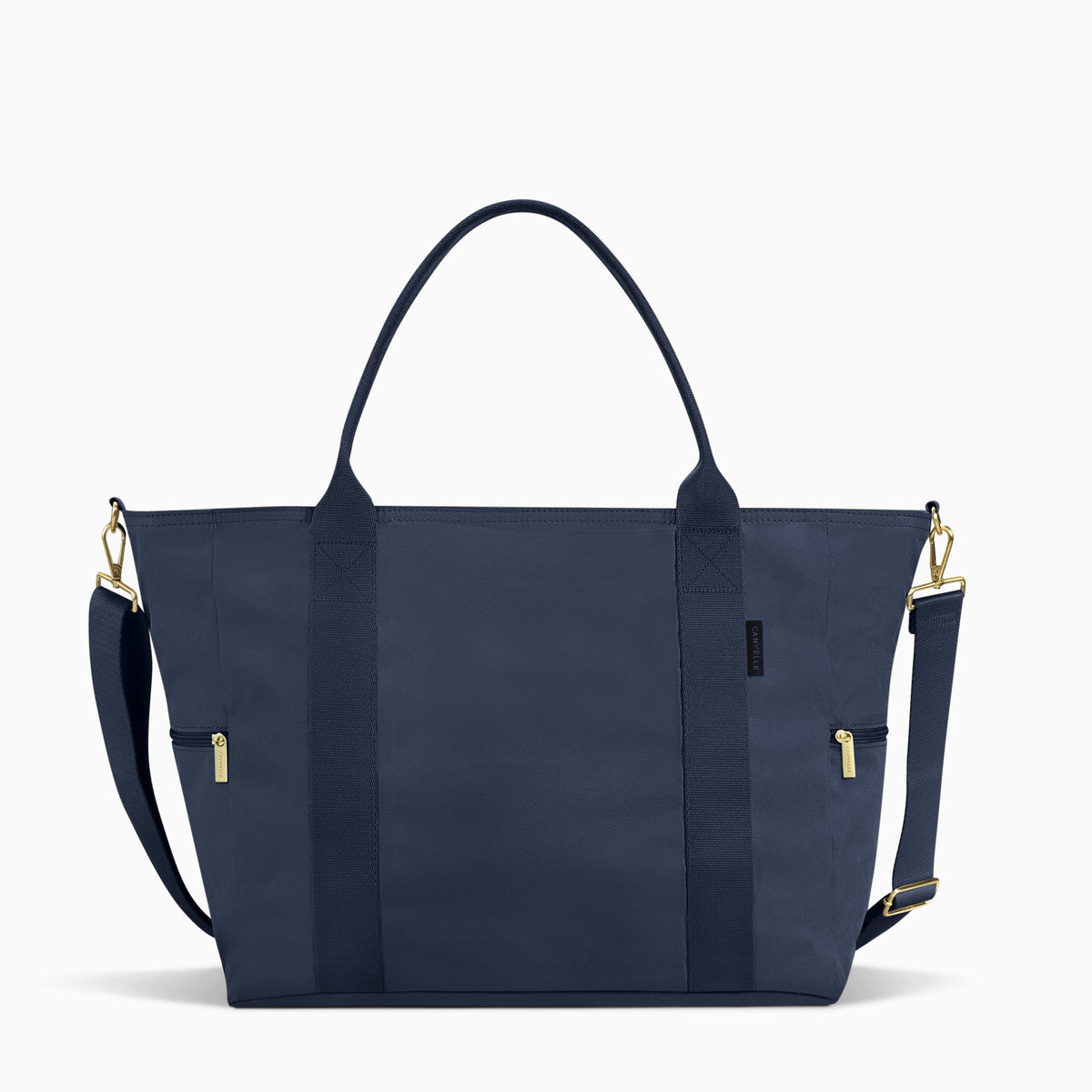 Navy Canvelle Weekender with gold hardware and detachable shoulder strap, front view