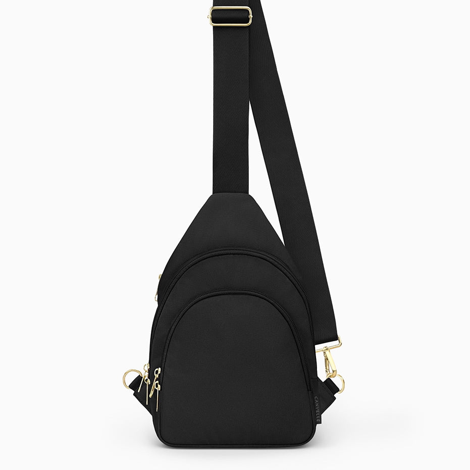 Canvelle City Sling Bag in medium black recycled polyester canvas with gold hardware - Front view.