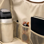 Open large brown Canvelle Hobo Handbag showing the beverage pocket, wipeable water-resistant lining, and three elastic mesh pockets.