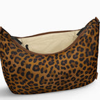 Open large brown leopard Canvelle Hobo Handbag showing the interior zip pocket and wipeable water-resistant lining.