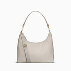 Canvelle Hobo Handbag in grey recycled polyester canvas with gold hardware – front view with shoulder strap.