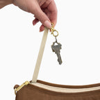 Keys on the built-in key clip inside the large brown Canvelle Hobo Handbag.