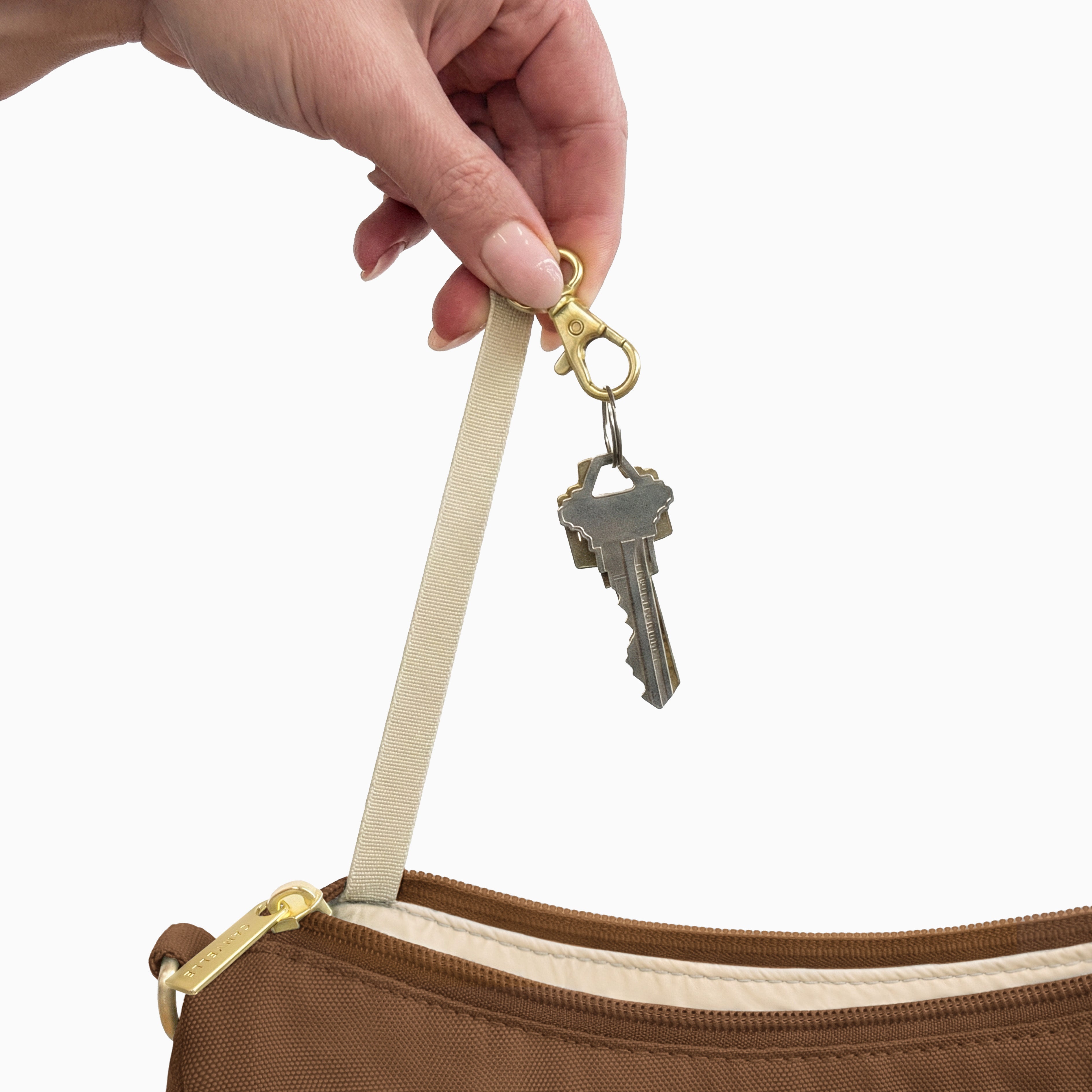 Keys on the built-in key clip inside the large brown Canvelle Hobo Handbag.