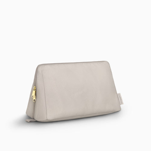 Canvelle Toiletry Bag in large grey recycled polyester canvas with gold hardware - Front view.