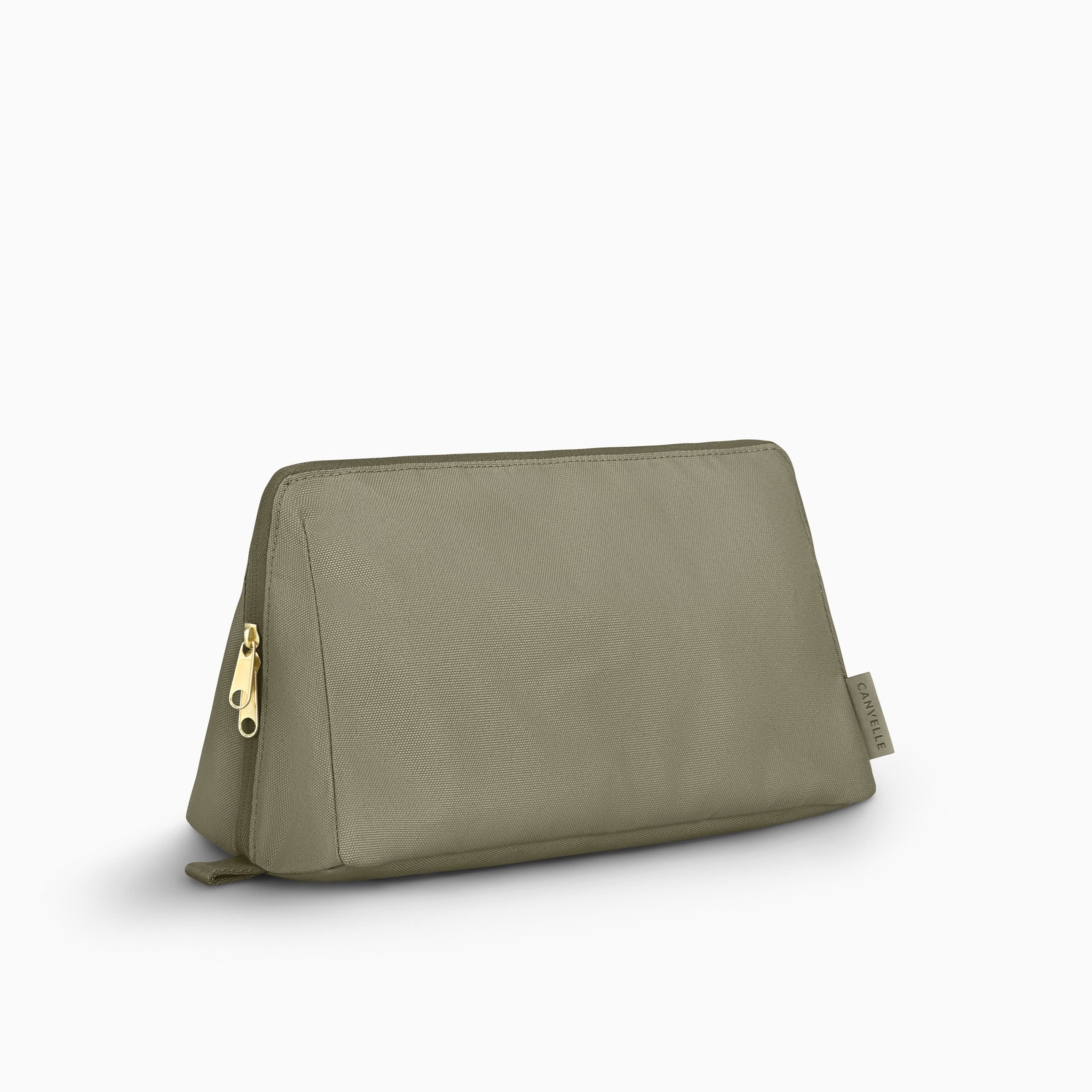 Canvelle Toiletry Bag in large olive green recycled polyester canvas with gold hardware - Front view.