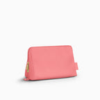 Canvelle Toiletry Bag in medium pink recycled polyester canvas with gold hardware - Front view.